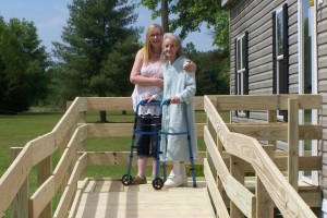 Janice Lowe and her daughter standing on her beautiful new ramp. 